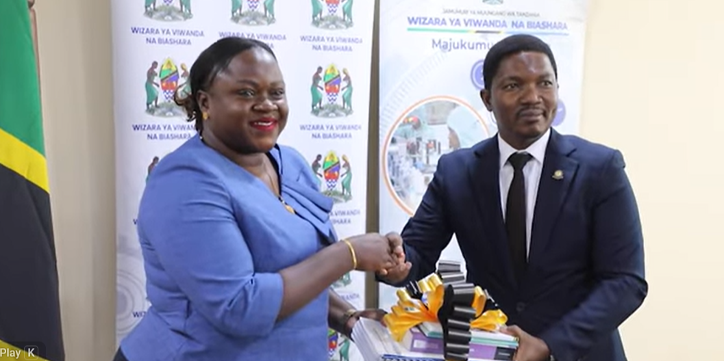 "The Minister for Industry and Trade is handed over office by his predecessor, heavy matters discussed.